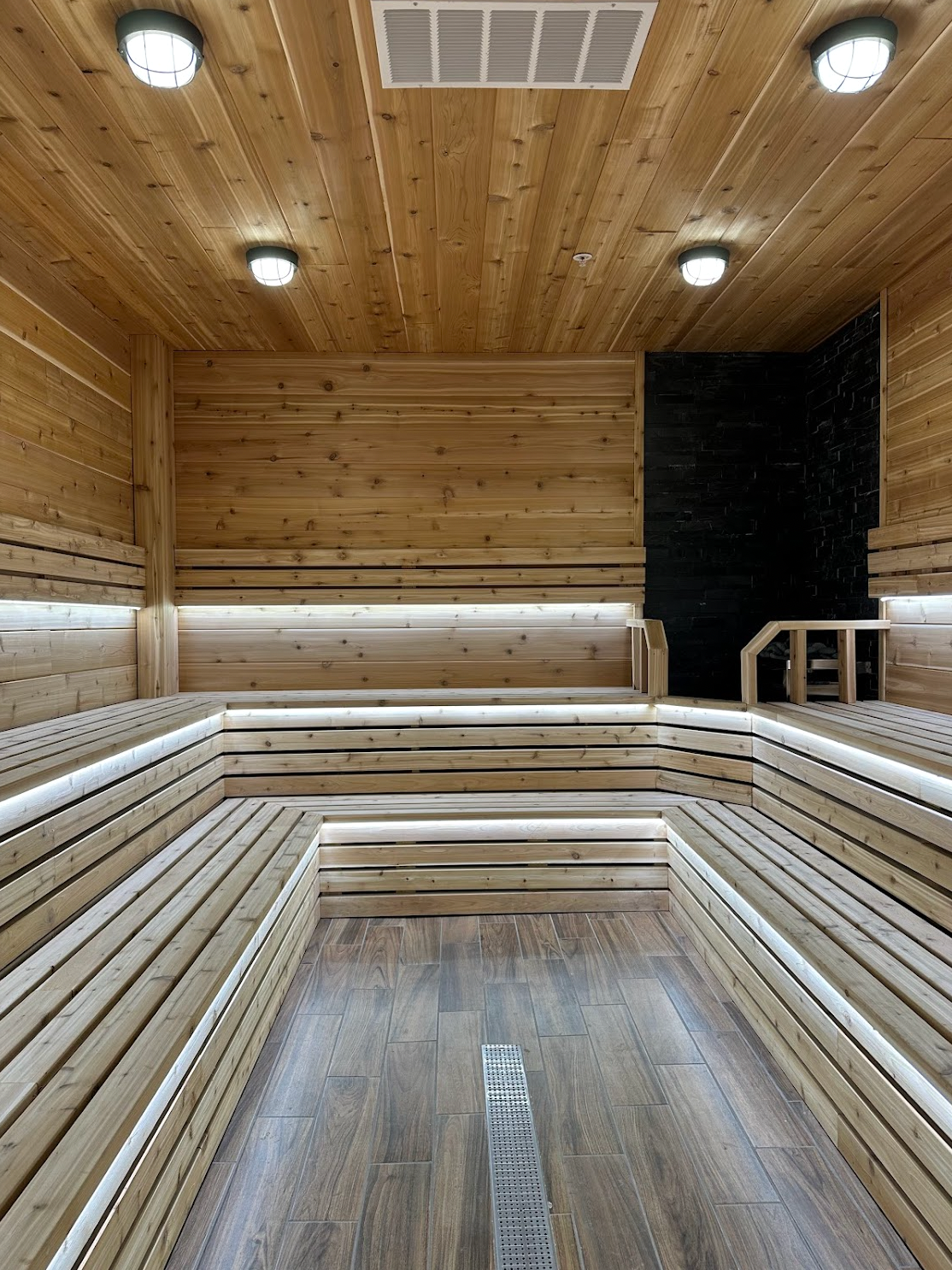 Separate men's and women's recovery spaces at Fire & Ice Sauna Bolingbrook: traditional dry sauna wing